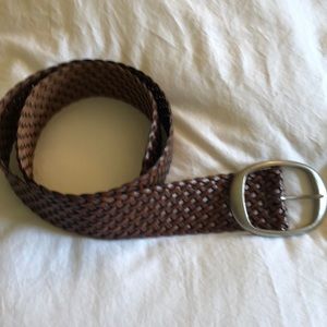 Woven brown leather belt with nickel buckle.